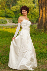 Fototapeta na wymiar Cute little girl in a wedding dress