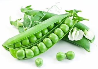 Pods of green peas with leaves