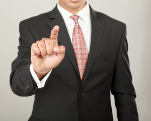 A businessman showing something isolated on white background