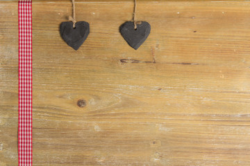 Heart of slate on a wood panel.