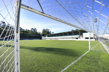 football or soccer goal and blue sky in the stadium