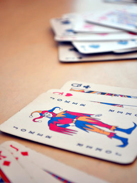 Detail view of poker cards, focused on Joker