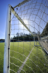 football or soccer goal and blue sky in the stadium