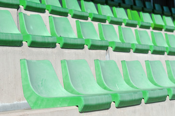 Obraz premium In the stadium, stands and seats in green