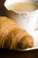 breakfast with cup of black coffee and croissants