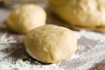 Dough on wooden board