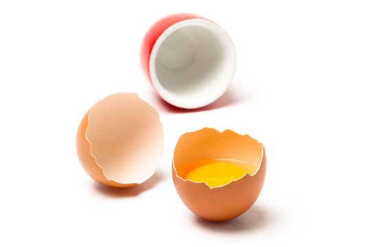 Egg and cup isolated on white background