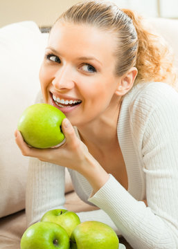 Happy smiling woman with apples