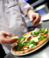 Closeup hand of chef baker in white uniform making pizza at kitc - 50700158