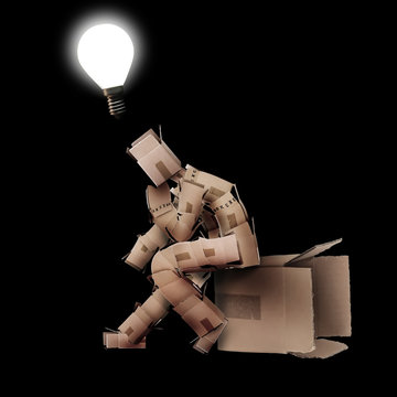 Light Bulb Moment Concept With Box Man On Black Background