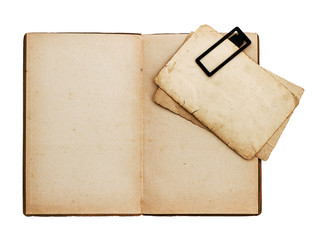 open old book with postcard isolated on white