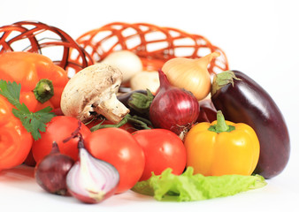 Composition with raw vegetables and wicker basket
