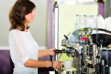 Waitress in cafe making coffee