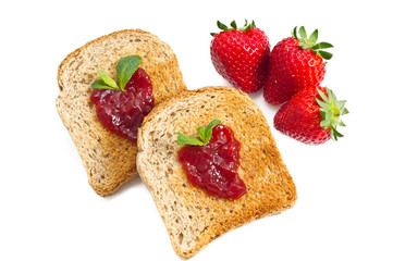 sweet strawberries jam on toast close up