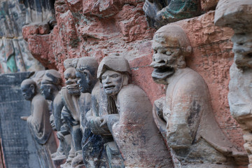 Fototapeta na wymiar Ancient Buddhist Hillside Rock Carvings in Dazu town