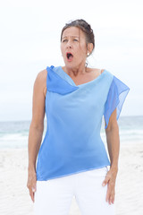 Portrait surprised mature woman blue blouse