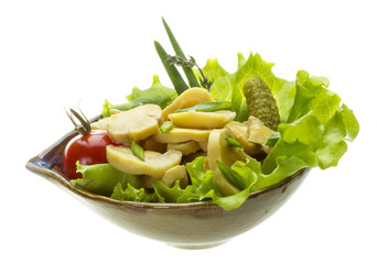 Marinated mushrooms in white saucer isolated on white