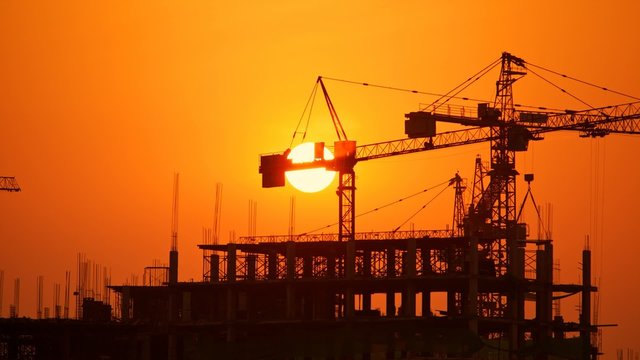 Construction site at sunset, time lapse