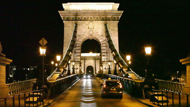 Night traffic of cars on Secheni Bridge through Danube