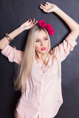 Fototapeta premium Portrait of beautiful young blond haired woman in shirt