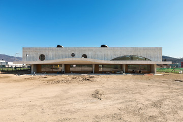 building under construction, outside, front view