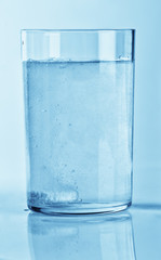 Fizzy tablet in a glass of water
