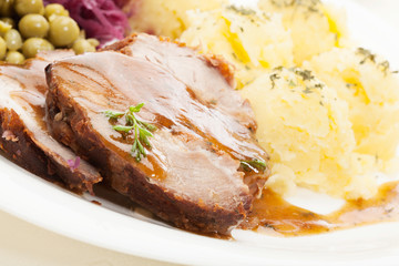 Roast pork with sauce. Selective focus.