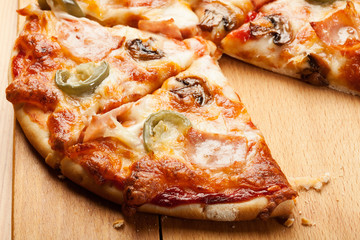 Pizza with cheese, ham and jalapeno pepper
