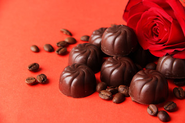 Obraz na płótnie Canvas Chocolate candies, on red background