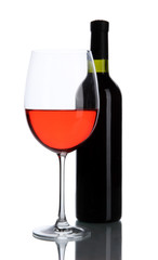 Red wine glass and bottle of wine isolated on white
