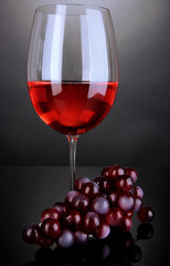 Red wine glass on grey background