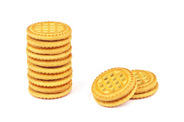 Sandwich biscuits with chocolate filling on a white background