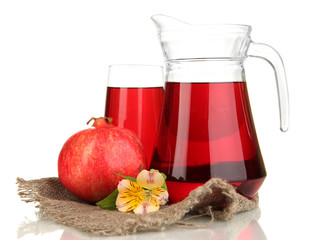 Full glass and jug of pomegranate juice and pomegranate