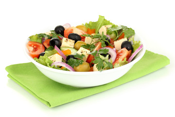Greek salad in plate isolated on white