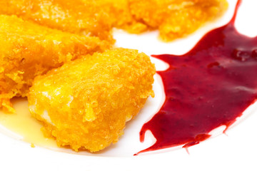 Fried Cheese with Berry Sauce on plate