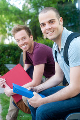 pair of happy young male students