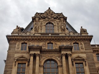 Fototapeta na wymiar Facade of Louvre. Art museum. France. June 19, 2012.