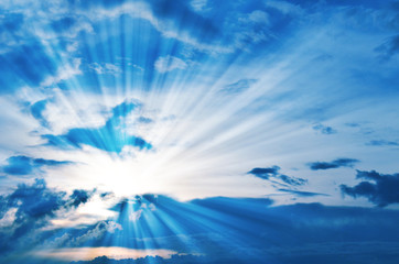 Blue sky with clouds and sunlight.