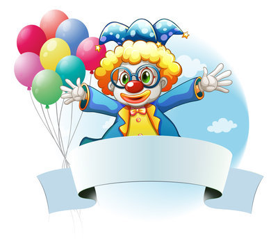 A clown with balloons and the empty signage