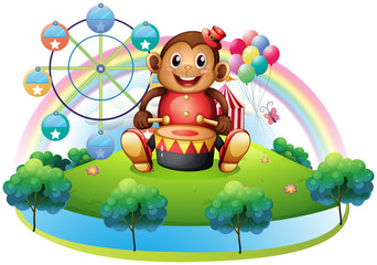 Obraz na płótnie Canvas A musical monkey near the ferris wheel