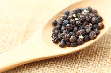 pepper in wooden spoon
