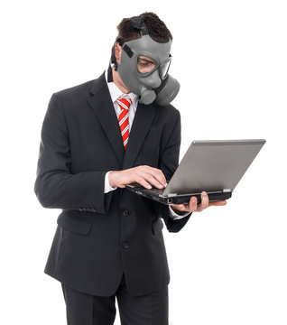 Busniess Man With Gas Mask Using Laptop, Isolated On White