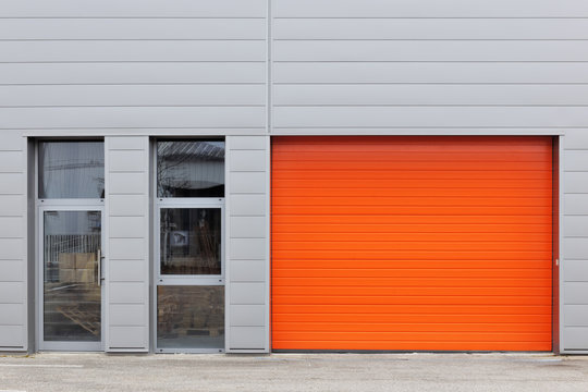 Industrial warehouse with orange roller door