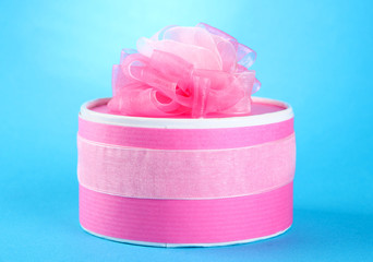 Bright gift with bow on blue background
