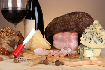 Exquisite still life of wine, cheese and meat products