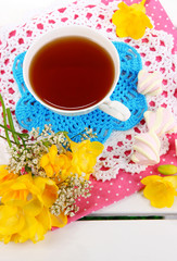 Beautiful composition with cup of tea and marshmallow