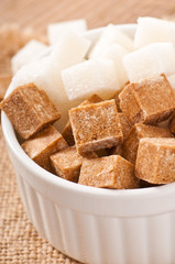 Close-up of cubes of brown and white sugar