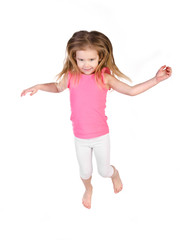 Adorable little girl jumping in air isolated
