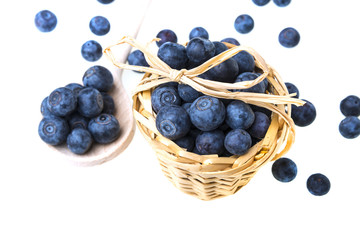 still life with fresh blueberries on white background