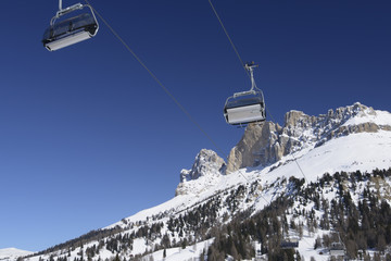 line of chair lift seats under Rotewand, Costalunga pass